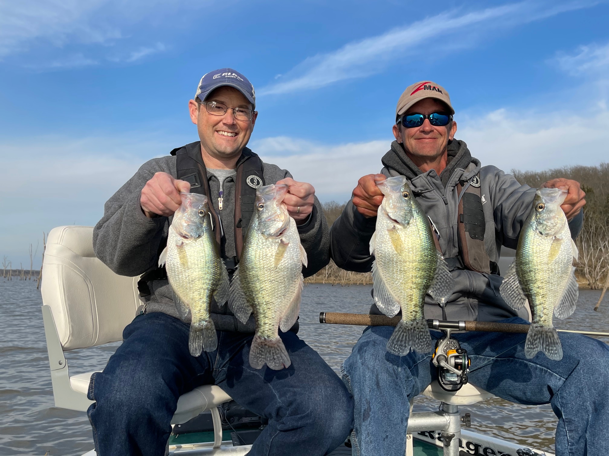 Guide Joe Bragg (right) and David Harrison held proof that Kansas boasts some big crappies. They caught these fish in late March on <a href="https://ksoutdoors.com/State-Parks/Locations/Clinton">Clinton Lake</a>.